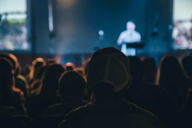Audience listening to a keynote speaker at a corporate event in Singapore